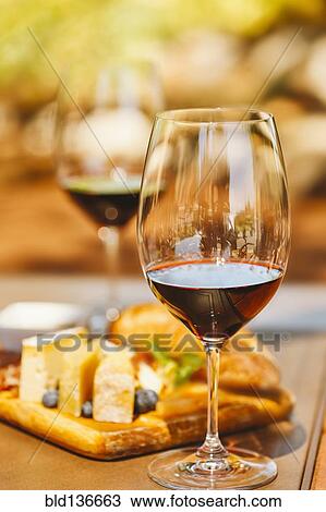 Glasses of wine with cheese and meat board View Large Photo Image Stock Image - Glasses of wine with cheese and meat board. Fotosearch