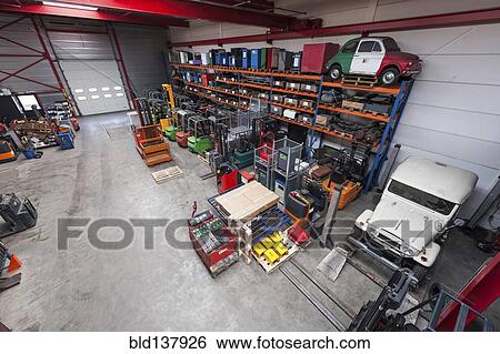 High angle view of machinery in warehouse View Large Photo Image Stock Photograph - High angle view of machinery in warehouse. Fotosearch