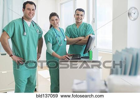 Hispanic nurses smiling in hospital View Large Photo Image Stock Photo - Hispanic nurses smiling in hospital. Fotosearch