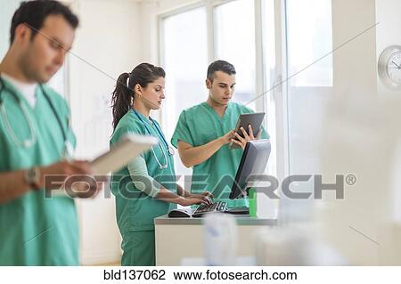 Hispanic nurses working in hospital View Large Photo Image Stock Image - Hispanic nurses working in hospital. Fotosearch