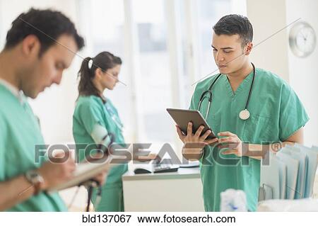 Hispanic nurses working in hospital View Large Photo Image Stock Photo - Hispanic nurses working in hospital. Fotosearch