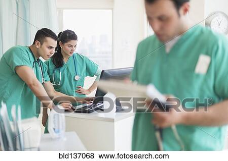 Stock Photo - Hispanic nurses working in hospital. Fotosearch