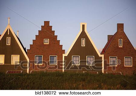 Houses with triangular roofs built side by side View Large Photo Image Stock Image - Houses with triangular roofs built side by side. Fotosearch