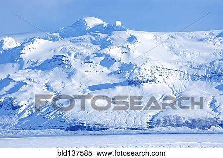 Iceberg looming over arctic landscape View Large Photo Image Stock Photography - Iceberg looming over arctic landscape. Fotosearch