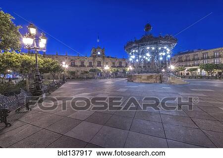 Stock Photo - Illuminated monument in Plaza de Armas, Guadalajara, Jalisco, Mexico. Fotosearch