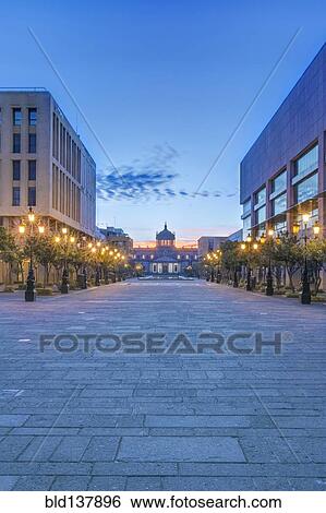 Stock Photograph - Illuminated street lamps on city street at dusk, Guadalajara, Jalisco, Mexico. Fotosearch