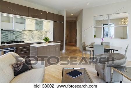 Kitchen, dining and living room in urban apartment View Large Photo Image Stock Image - Kitchen, dining and living room in urban apartment. Fotosearch