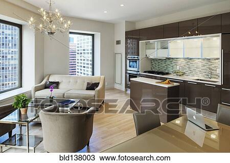 Stock Image - Kitchen, dining and living room in urban apartment. Fotosearch