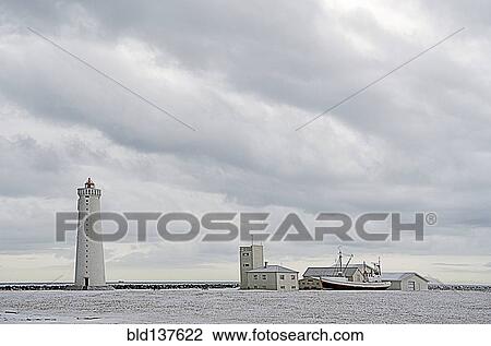 Lighthouse overlooking coastline View Large Photo Image Stock Image - Lighthouse overlooking coastline. Fotosearch