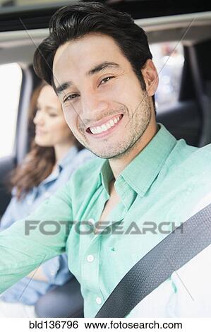 Stock Photograph - Man smiling in car. Fotosearch