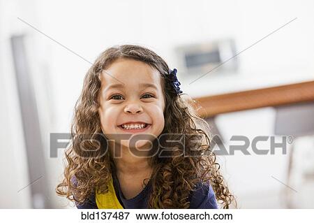 Stock Photo - Mixed race girl smiling. Fotosearch