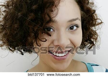 Stock Image - Mixed race woman smiling. Fotosearch