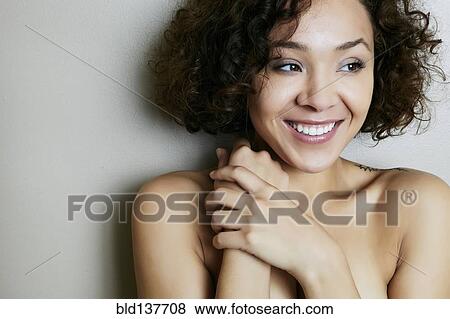 Stock Photo - Mixed race woman smiling. Fotosearch
