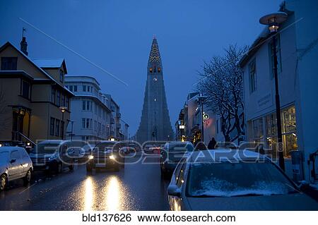 Stock Photograph - Monument overlooking Reykjavik city street at dusk, Hofudborgarsvaedi, Iceland. Fotosearch