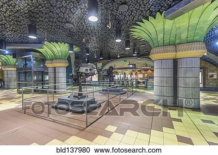 Stock Image - Ornate pillars and movie reels on ceiling in subway station, Los Angeles, California, United States. Fotosearch