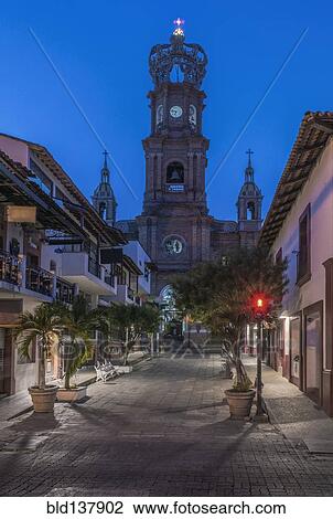Stock Image - Our Lady of Guadalupe church overlooking Puerto Vallarta street, Jalisco, Mexico. Fotosearch