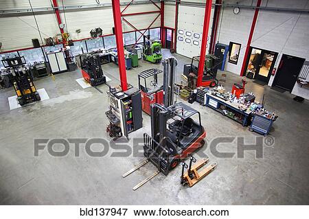 Stock Photo - Overhead view of machinery in warehouse office. Fotosearch