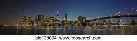 Panoramic view of New York city skyline illuminated at night, New York, United States View Large Photo Image Picture - Panoramic view of New York city skyline illuminated at night, New York, United States. Fotosearch