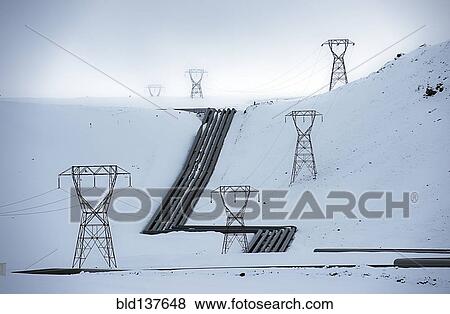 Stock Photo - Power lines in snowy arctic landscape. Fotosearch