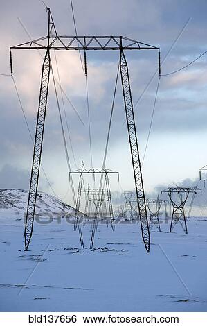 Stock Photograph - Power lines in snowy landscape. Fotosearch
