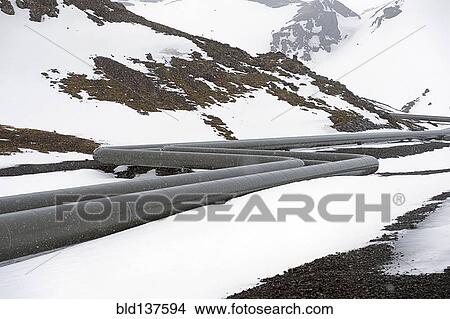 Picture - Power plant pipes in arctic landscape. Fotosearch
