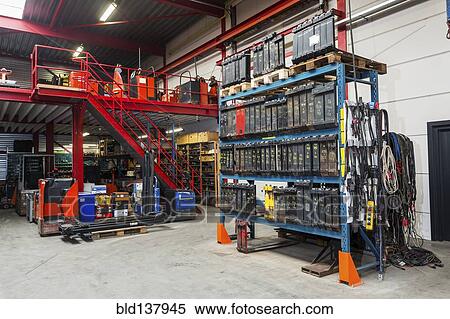 Shelves and machinery in warehouse View Large Photo Image Stock Photography - Shelves and machinery in warehouse. Fotosearch