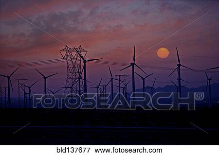 Silhouette of wind turbines and power lines at sunset View Large Photo Image Stock Photo - Silhouette of wind turbines and power lines at sunset. Fotosearch