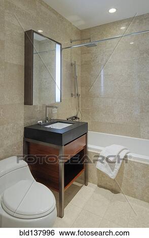 Sink, toilet and bath of modern bathroom View Large Photo Image Stock Photograph - Sink, toilet and bath of modern bathroom. Fotosearch