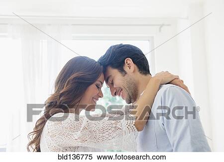 Smiling couple hugging View Large Photo Image Stock Photography - Smiling couple hugging. Fotosearch