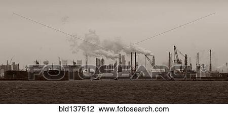 Smoke billowing from distant factory View Large Photo Image Stock Image - Smoke billowing from distant factory. Fotosearch