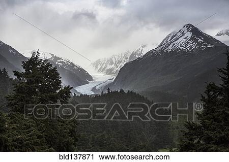 Stock Image - Snow covered mountains in rural landscape, Anchorage, Alaska, Denali National Park, United States. Fotosearch