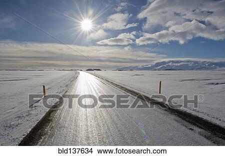 Tire trucks on rural road in snowy landscape View Large Photo Image Picture - Tire trucks on rural road in snowy landscape. Fotosearch