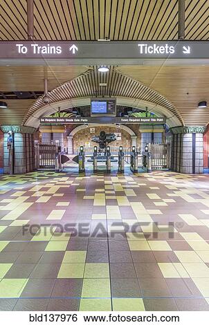 Turnstiles and signs in subway station View Large Photo Image Stock Photograph - Turnstiles and signs in subway station. Fotosearch