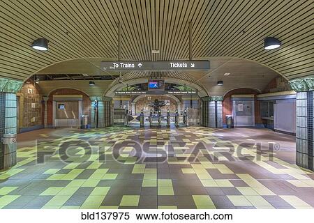 Turnstiles and signs in subway station View Large Photo Image Stock Photography - Turnstiles and signs in subway station. Fotosearch