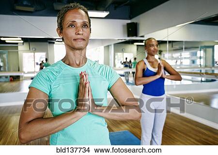 Women practicing yoga in studio View Large Photo Image Picture - Women practicing yoga in studio. Fotosearch