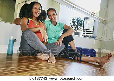 Women talking in yoga studio View Large Photo Image Stock Image - Women talking in yoga studio. Fotosearch