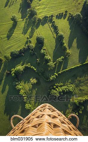 Stock Photography - Aerial view from hot air balloon overlooking rural fields. Fotosearch