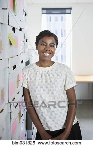 African American businesswoman smiling in office View Large Photo Image Stock Photography - African American businesswoman smiling in office. Fotosearch