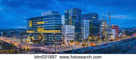 Stock Photo - Buildings in Oslo city skyline at sunset, Ostlandet, Norway. Fotosearch
