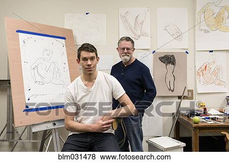 Stock Photo - Caucasian artist and student smiling in studio. Fotosearch