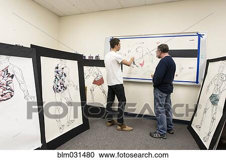 Caucasian artist teaching student in studio View Large Photo Image Stock Image - Caucasian artist teaching student in studio. Fotosearch