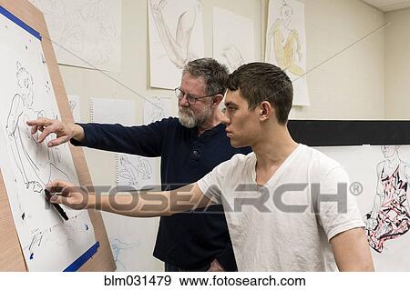 Caucasian artist teaching student in studio View Large Photo Image Stock Photo - Caucasian artist teaching student in studio. Fotosearch