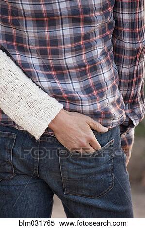 Caucasian woman putting hand in pocket of boyfriend View Large Photo Image Stock Photography - Caucasian woman putting hand in pocket of boyfriend. Fotosearch