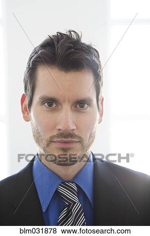 Stock Photo - Close up of mixed race businessman's face. Fotosearch