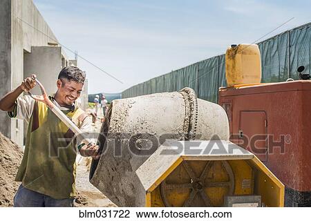 Hispanic construction worker at construction site View Large Photo Image Stock Image - Hispanic construction worker at construction site. Fotosearch