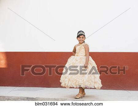 Hispanic girl posing in ornate gown and tiara View Large Photo Image Picture - Hispanic girl posing in ornate gown and tiara. Fotosearch