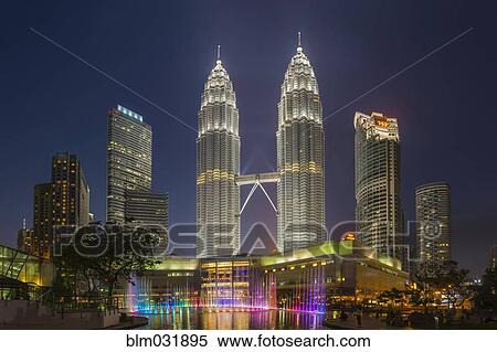 Stock Photography - Illuminated skyscrapers in Kuala Lumpur city skyline, Kuala Lumpur, Malaysia. Fotosearch