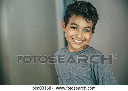 Mixed race boy smiling View Large Photo Image Stock Photo - Mixed race boy smiling. Fotosearch