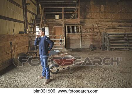 Mixed race boy talking on cell phone in barn View Large Photo Image Stock Photograph - Mixed race boy talking on cell phone in barn. Fotosearch