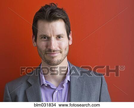 Picture - Mixed race businessman smiling. Fotosearch